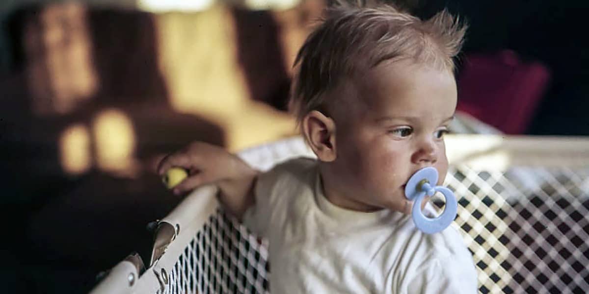Infant boy in crib